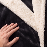 Cream sherpa collar and black plush close-up